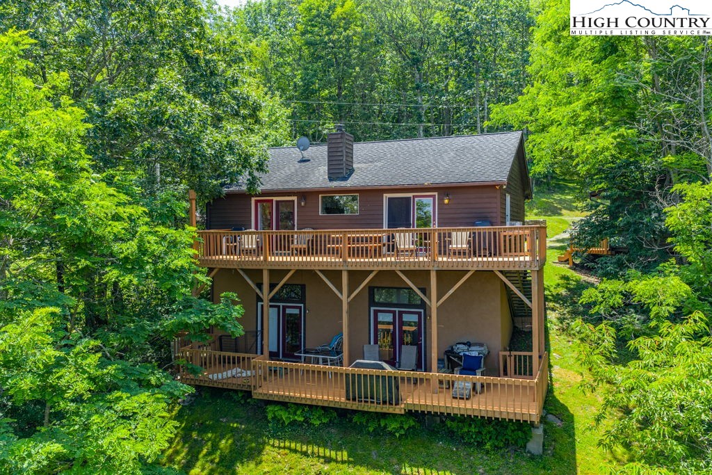 404 Running Deer Trail Boone, NC 28607 - Photo 1 of 38 an aerial view of a house with roof deck front of house