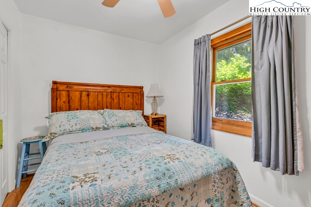 404 Running Deer Trail Boone, NC 28607 - Photo 15 of 38 a bedroom with a bed and a window