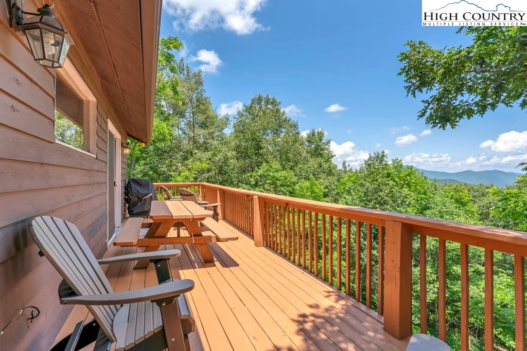 404 Running Deer Trail Boone, NC 28607 - Photo 19 of 38 a view of a balcony with chairs