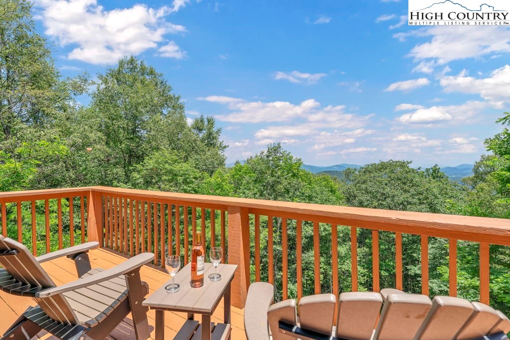404 Running Deer Trail Boone, NC 28607 - Photo 20 of 38 a view of a chair and tables on the roof deck