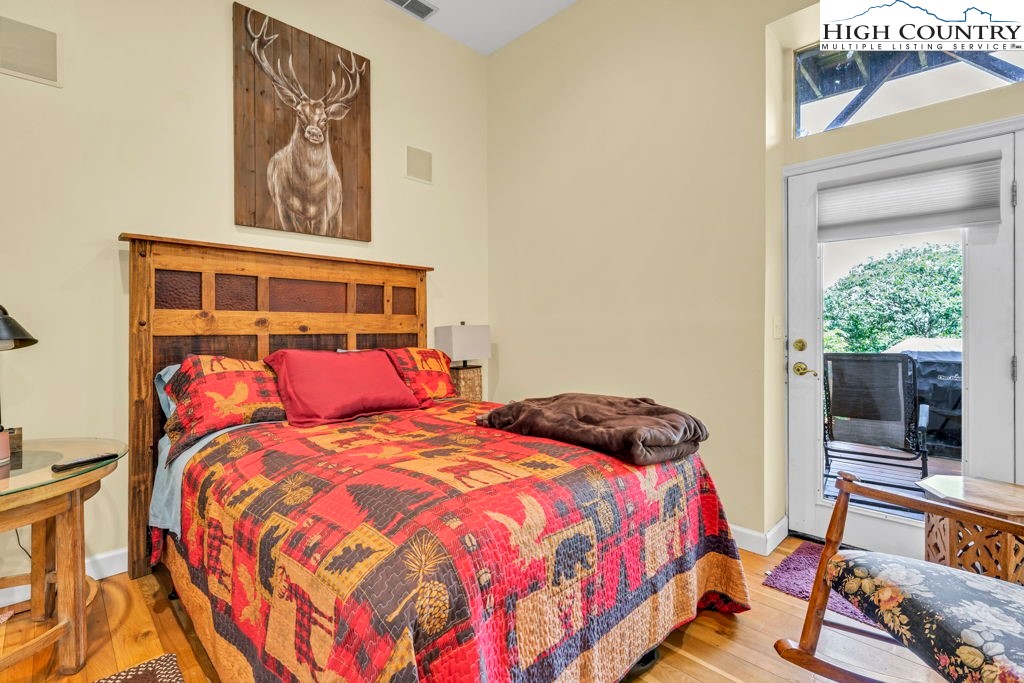404 Running Deer Trail Boone, NC 28607 - Photo 23 of 38 a bedroom with a bed and a window