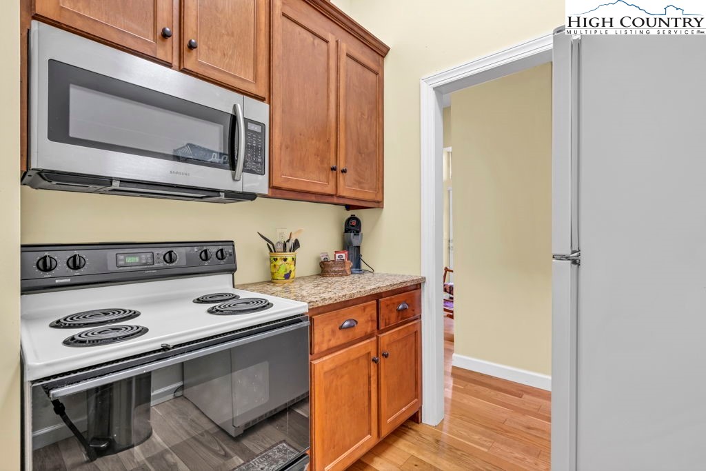 404 Running Deer Trail Boone, NC 28607 - Photo 26 of 38 a kitchen with a stove and a microwave