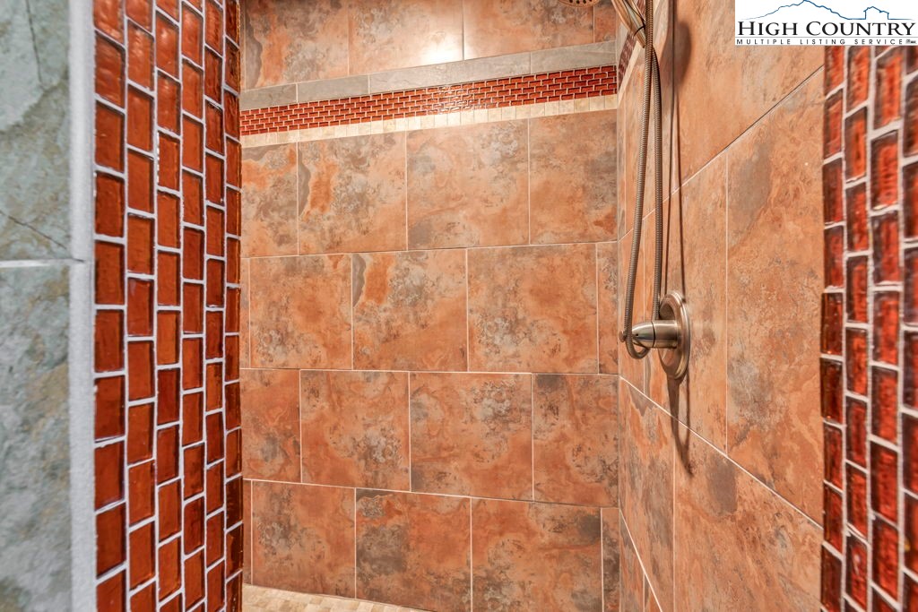 404 Running Deer Trail Boone, NC 28607 - Photo 28 of 38 a bathroom with a shower