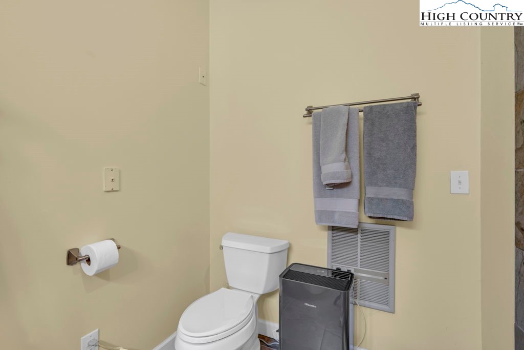 404 Running Deer Trail Boone, NC 28607 - Photo 29 of 38 a white toilet sitting next to a bathroom sink
