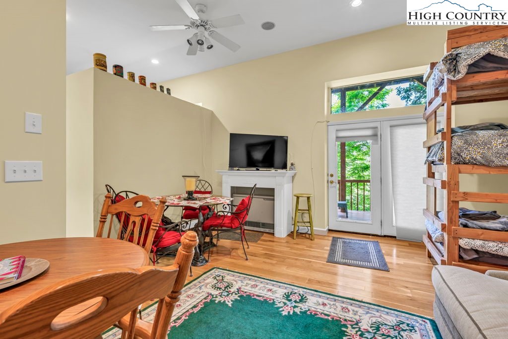 404 Running Deer Trail Boone, NC 28607 - Photo 32 of 38 a living room with furniture and a flat screen tv