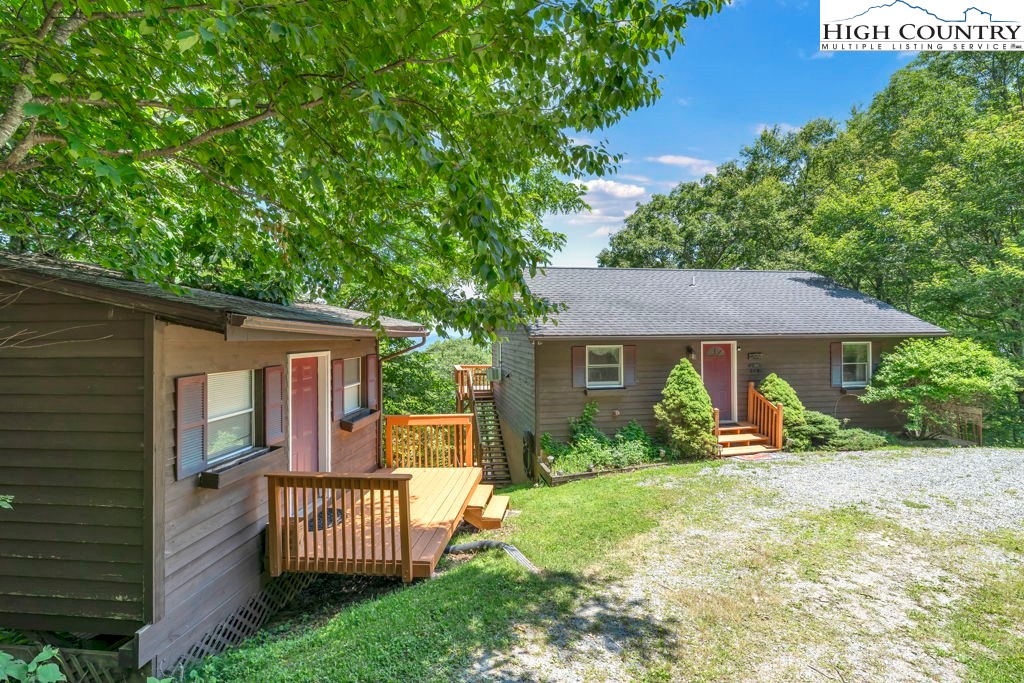 404 Running Deer Trail Boone, NC 28607 - Photo 34 of 38 front view of a house with a yard