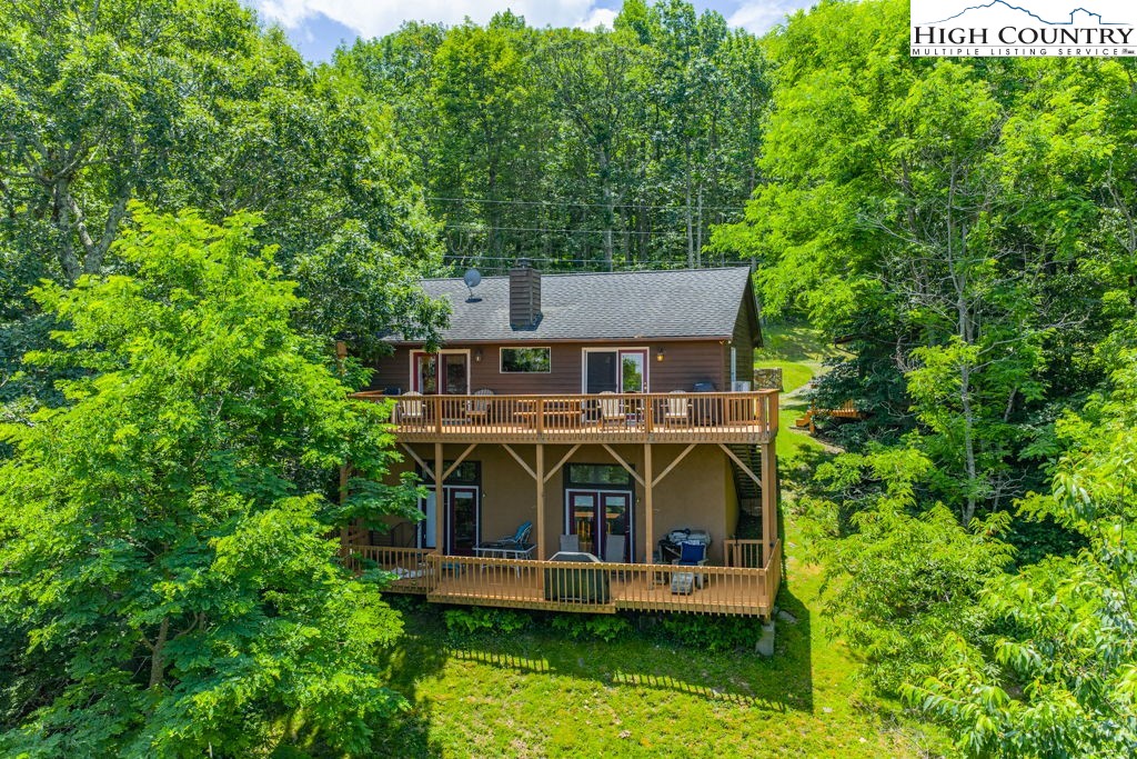 404 Running Deer Trail Boone, NC 28607 - Photo 38 of 38 an aerial view of a house with swimming pool and garden