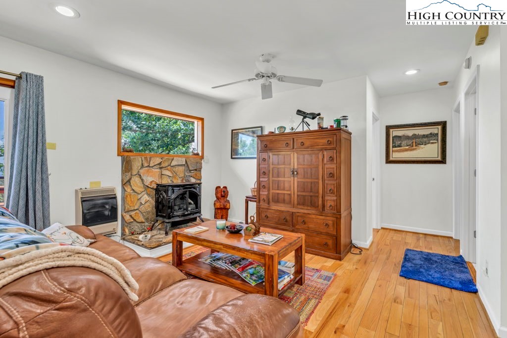 404 Running Deer Trail Boone, NC 28607 - Photo 7 of 38 a bedroom with a bed and a couch
