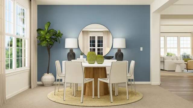 a dining room with furniture a potted plant and wooden floor