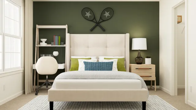 a bedroom with a bed and a painting on the wall