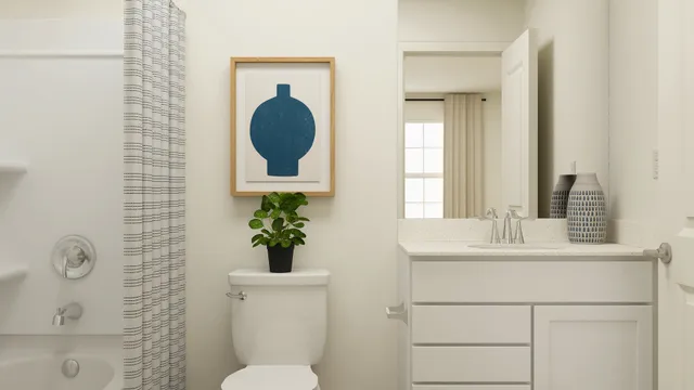 a bathroom with a toilet a sink and a shower