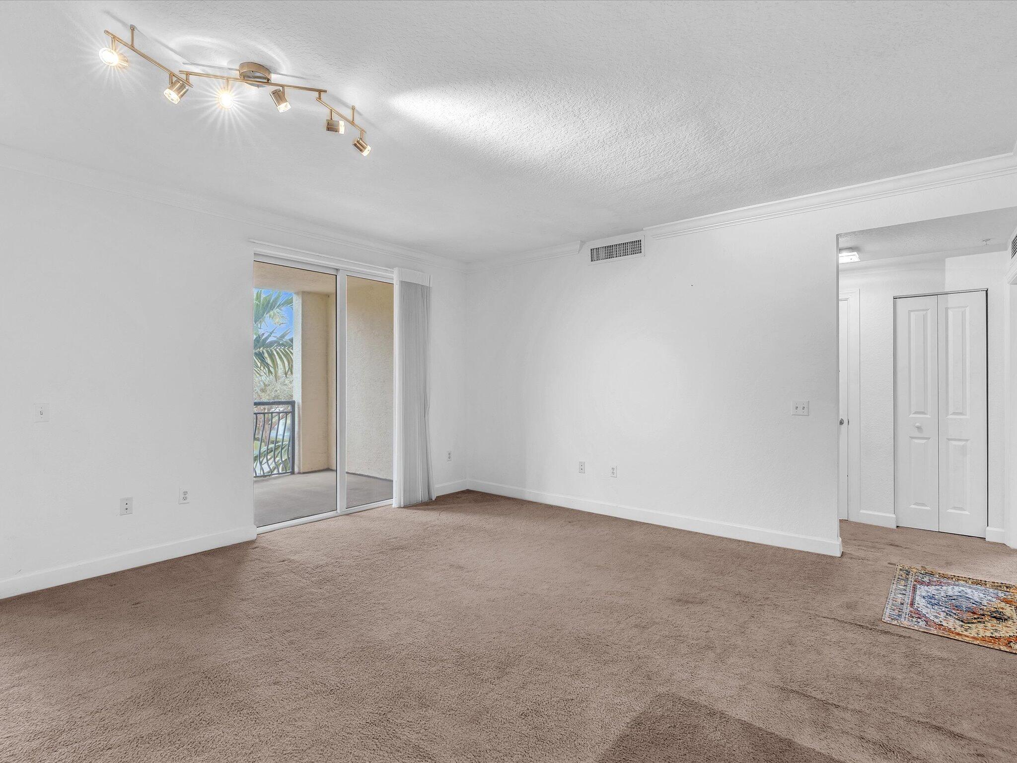 4303 Renaissance Way, Unit 303 Boynton Beach, FL 33426 - Photo 19 of 74 a view of an empty room with a window