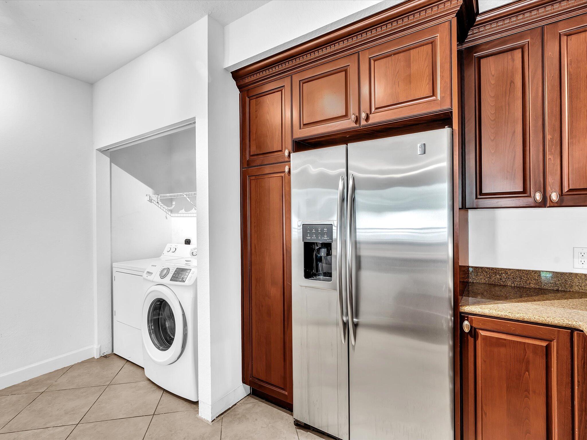4303 Renaissance Way, Unit 303 Boynton Beach, FL 33426 - Photo 25 of 74 a utility room with dryer and washer