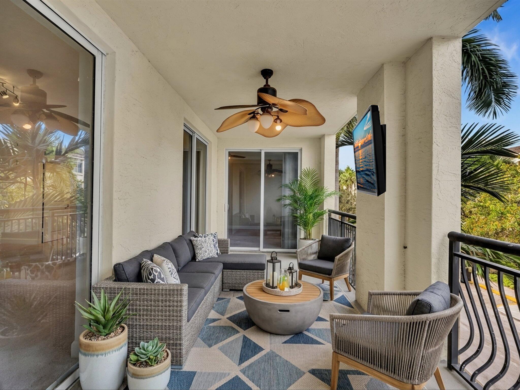 4303 Renaissance Way, Unit 303 Boynton Beach, FL 33426 - Photo 29 of 74 a living room with furniture and a potted plant