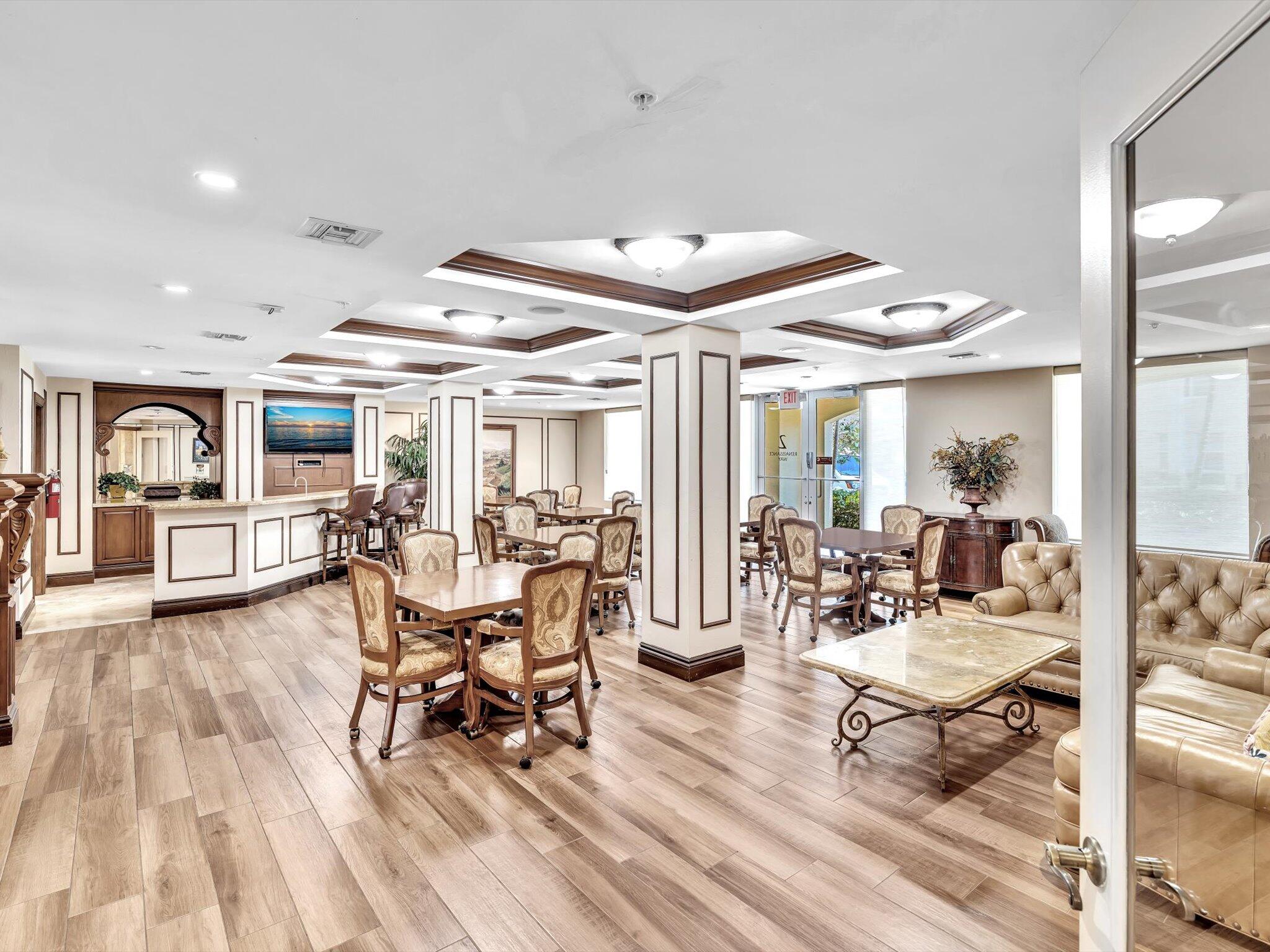 4303 Renaissance Way, Unit 303 Boynton Beach, FL 33426 - Photo 57 of 74 a living room with lots of furniture and view of kitchen