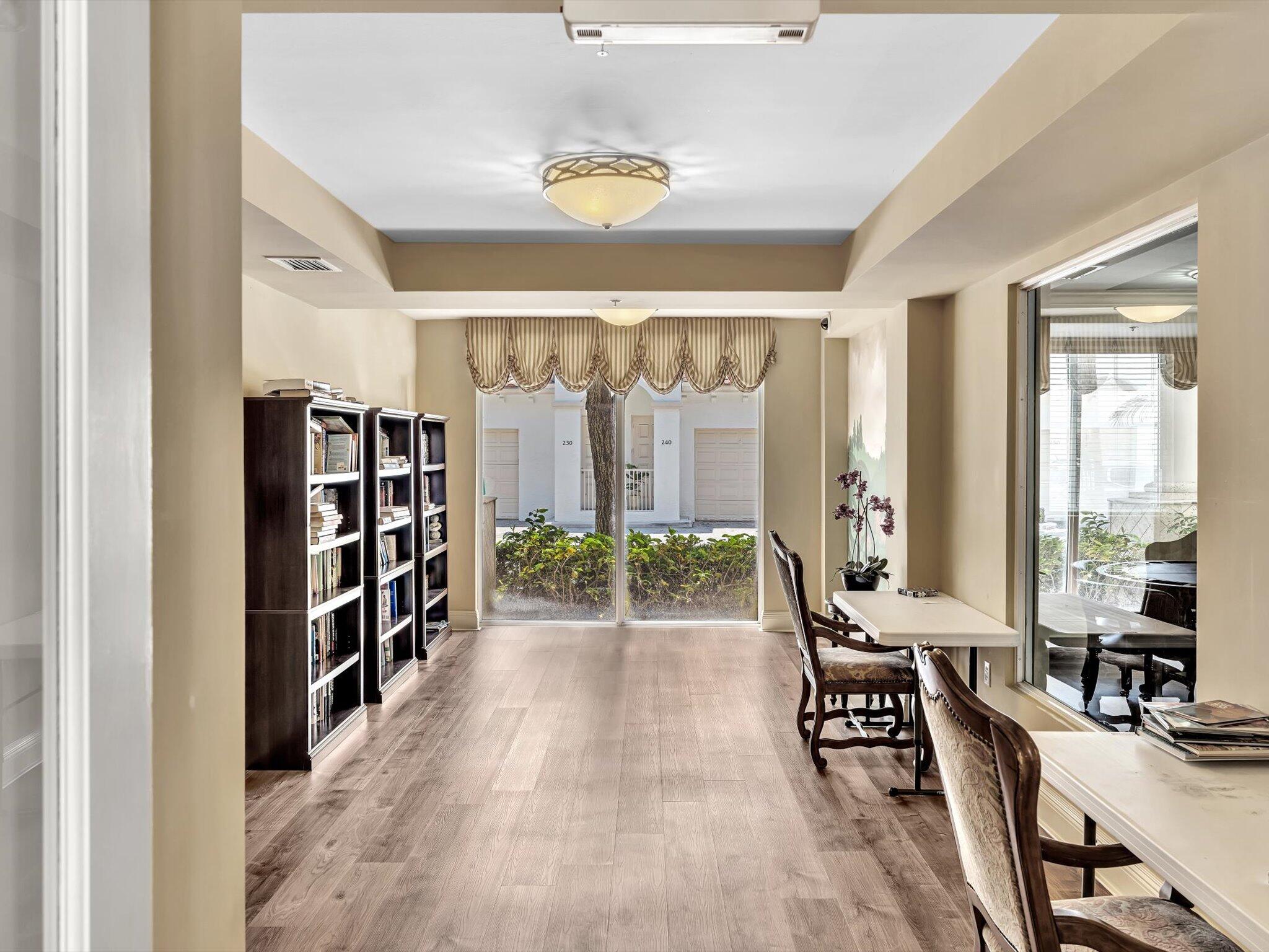 4303 Renaissance Way, Unit 303 Boynton Beach, FL 33426 - Photo 59 of 74 a room with lots of furniture and a large window