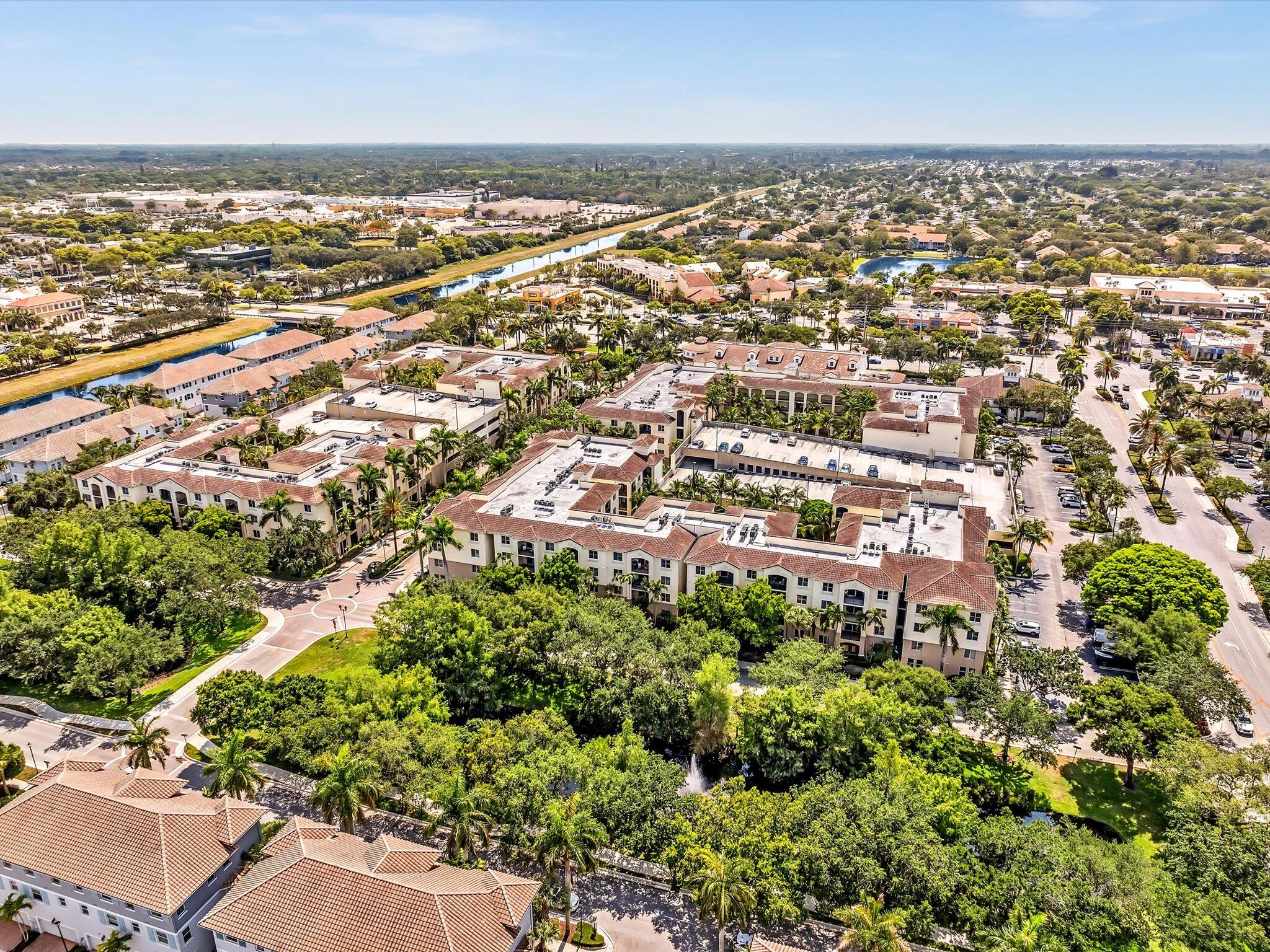 4303 Renaissance Way, Unit 303 Boynton Beach, FL 33426 - Photo 65 of 74 an aerial view of residential building with green space