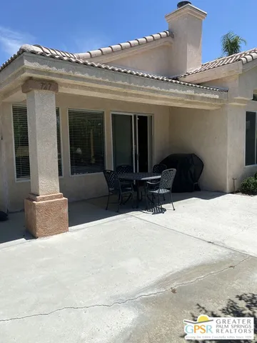 a view of a building with potted plants