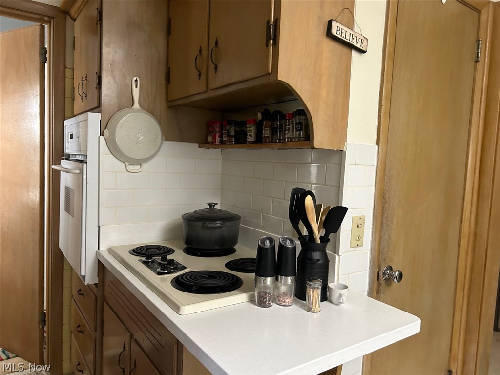 2537 Falmouth Road Akron, OH 44333 - Photo 6 of 35 Kitchen with tasteful backsplash and white appliances