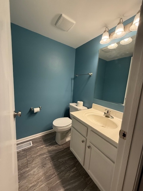 34404 North Barberry Road Round Lake, IL 60073 - Photo 10 of 14 a bathroom with a toilet sink and mirror