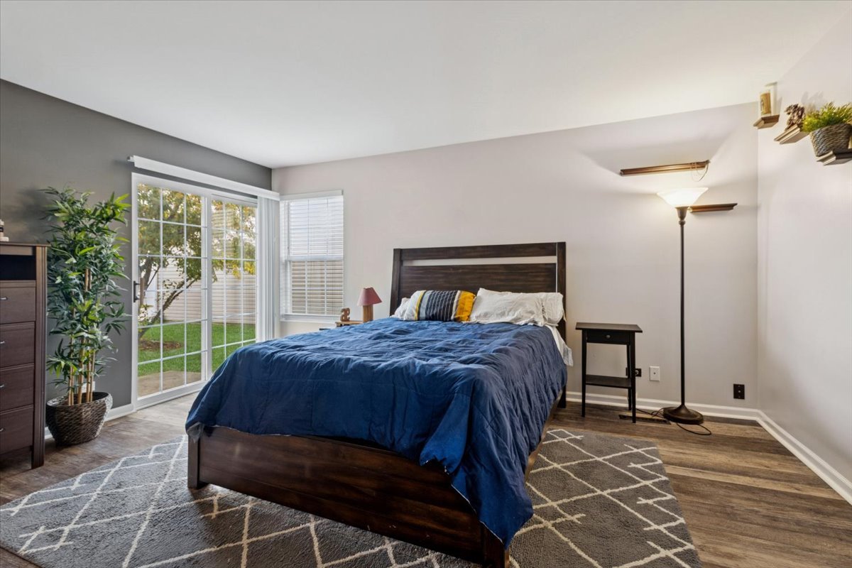 60 Wingate Drive, Unit 60 Oswego, IL 60543 - Photo 11 of 23 a bedroom with a bed and a window