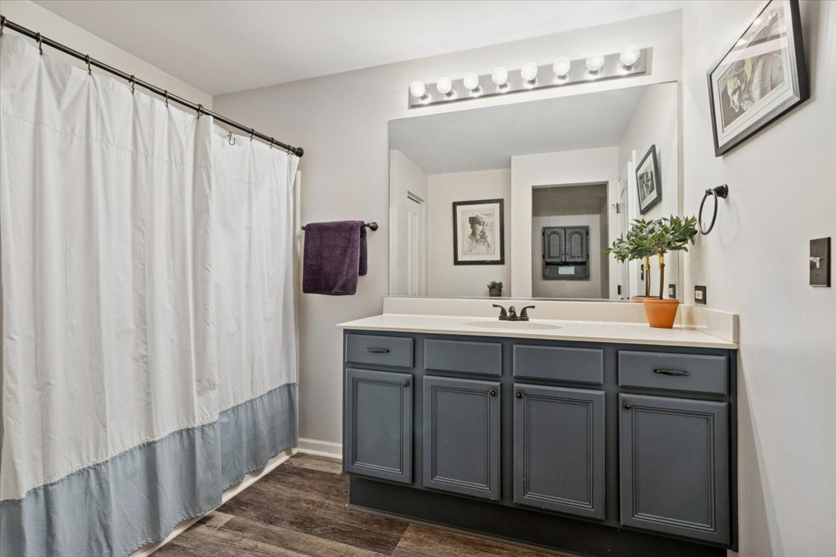 60 Wingate Drive, Unit 60 Oswego, IL 60543 - Photo 13 of 23 a spacious bathroom with a double vanity sink and mirror