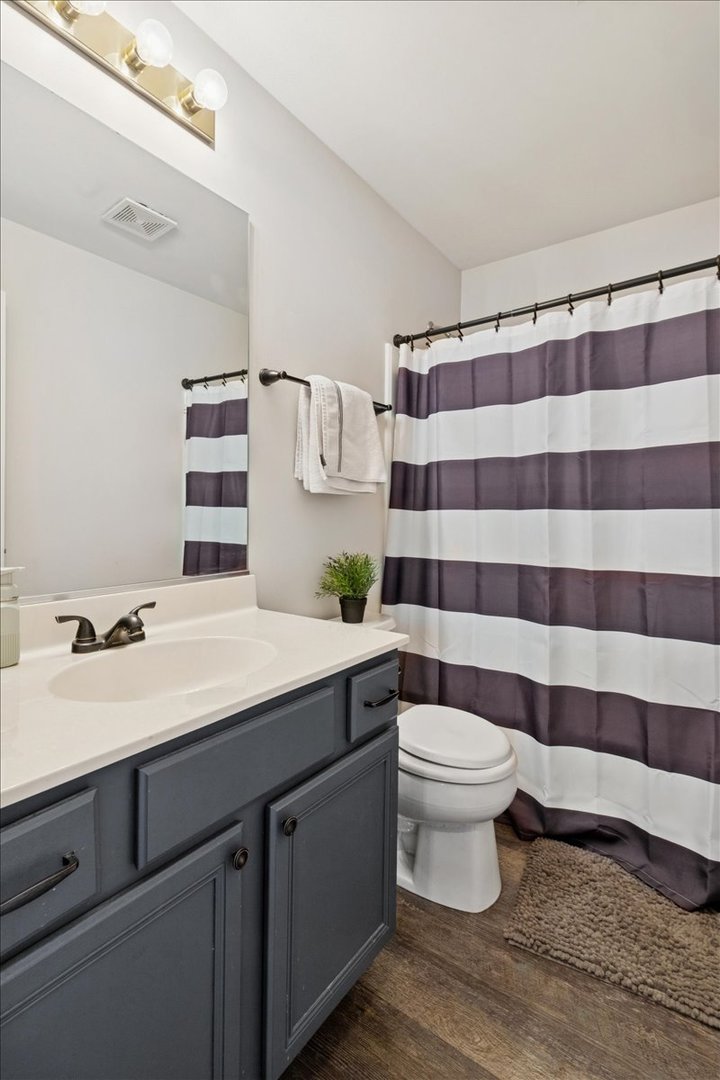 60 Wingate Drive, Unit 60 Oswego, IL 60543 - Photo 17 of 23 a bathroom with a sink toilet and shower
