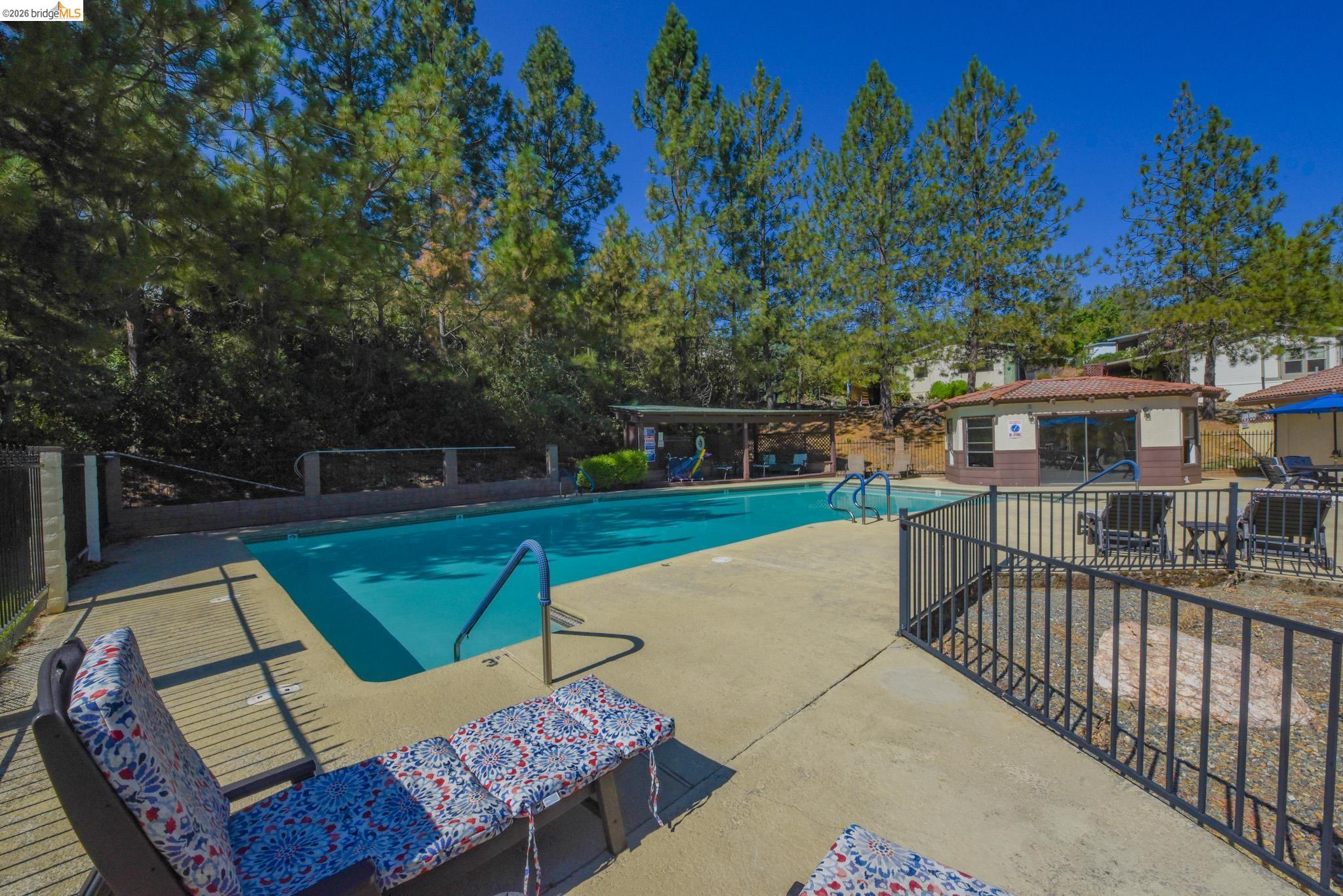18717 Mill Villa Road, Unit 235 Jamestown, CA 95327 - Photo 23 of 24 Community pool with a patio area and an outdoor structure