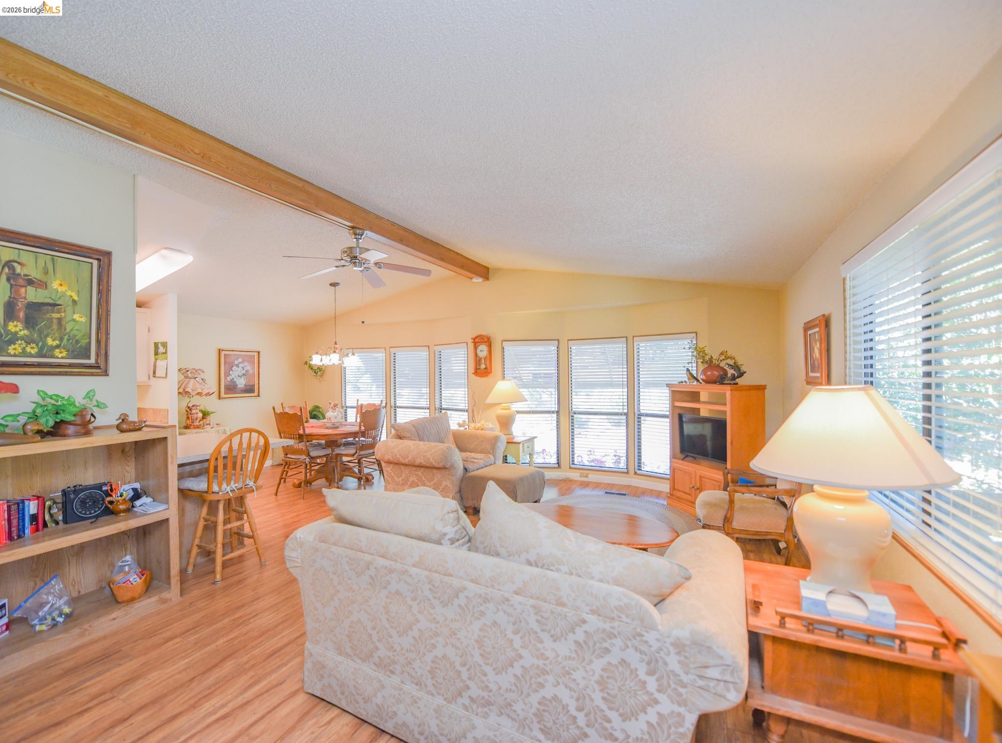 18717 Mill Villa Road, Unit 235 Jamestown, CA 95327 - Photo 8 of 24 Living area with light wood finished floors and ceiling fan