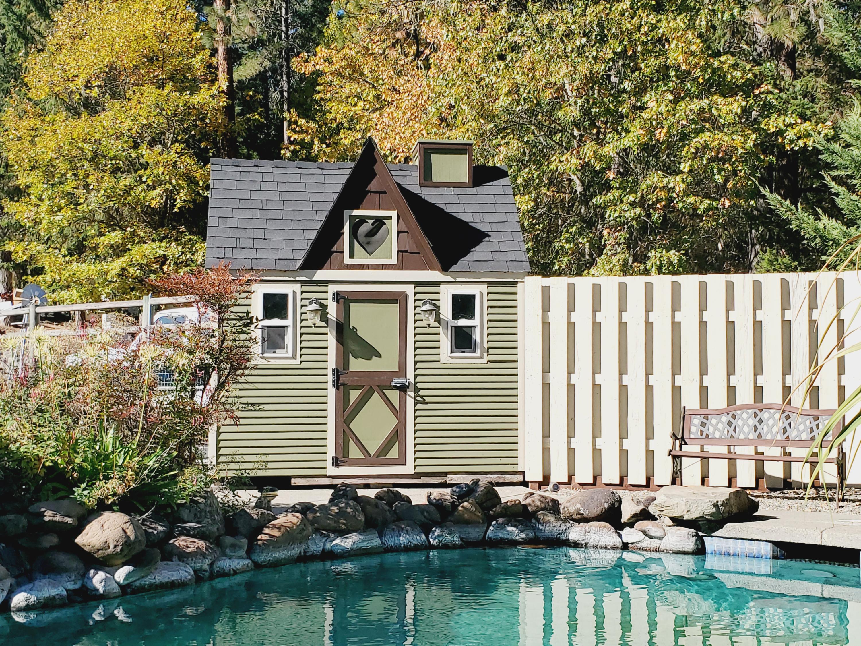 2144 Southwest Allen Creek Road Grants Pass, OR 97527 - Photo 52 of 55 Pool house storage area is just as cute as a button!