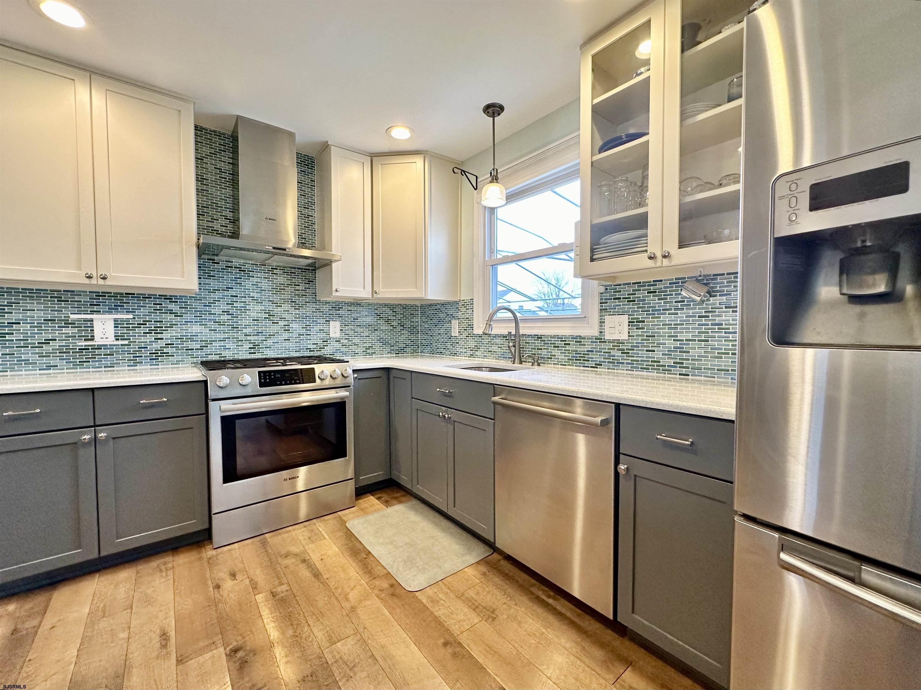 12 Explorer Road Brigantine, NJ 08203 - Photo 11 of 44 a kitchen with stainless steel appliances granite countertop a refrigerator and a stove