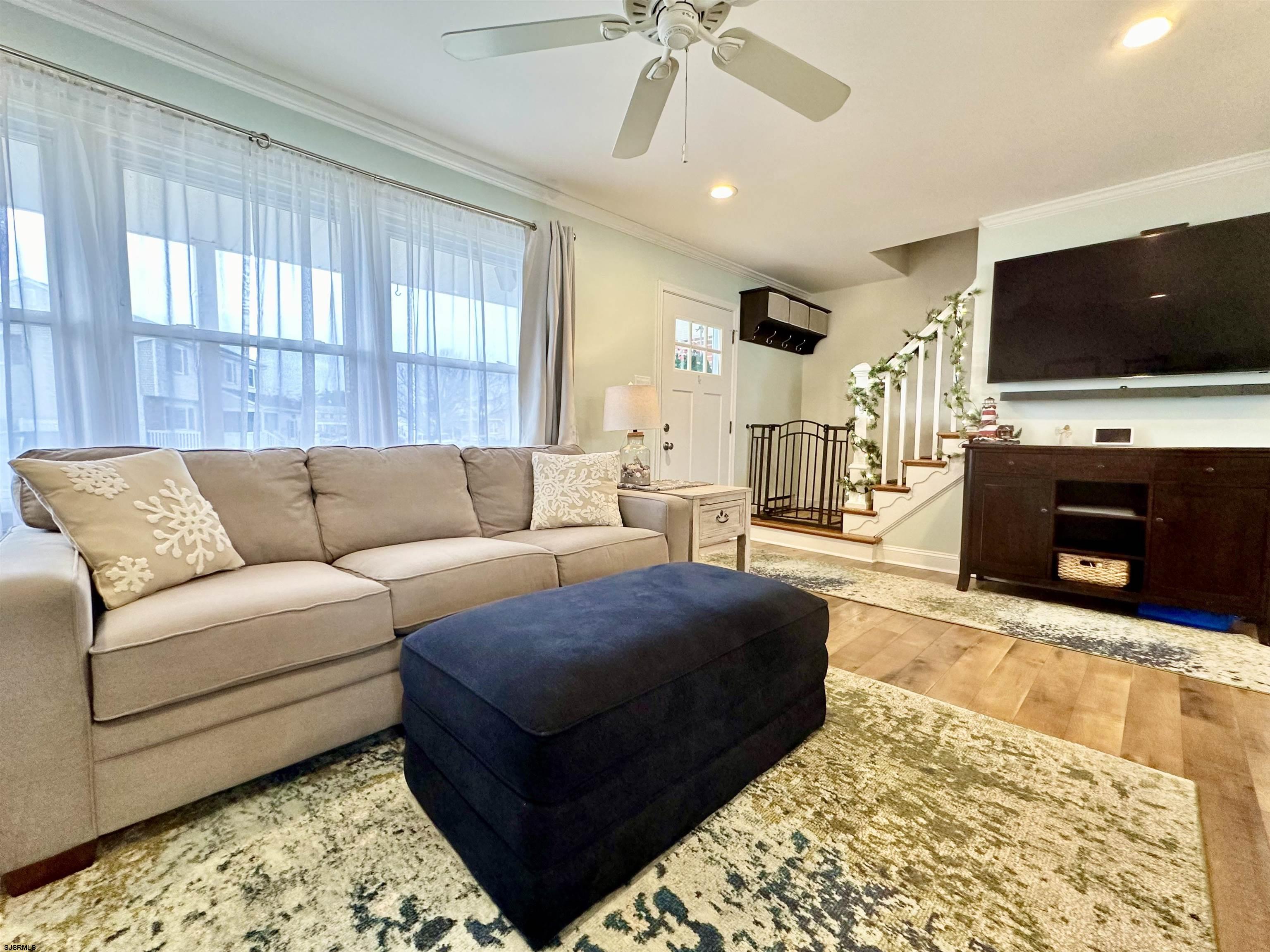 12 Explorer Road Brigantine, NJ 08203 - Photo 13 of 44 a living room with furniture and a flat screen tv
