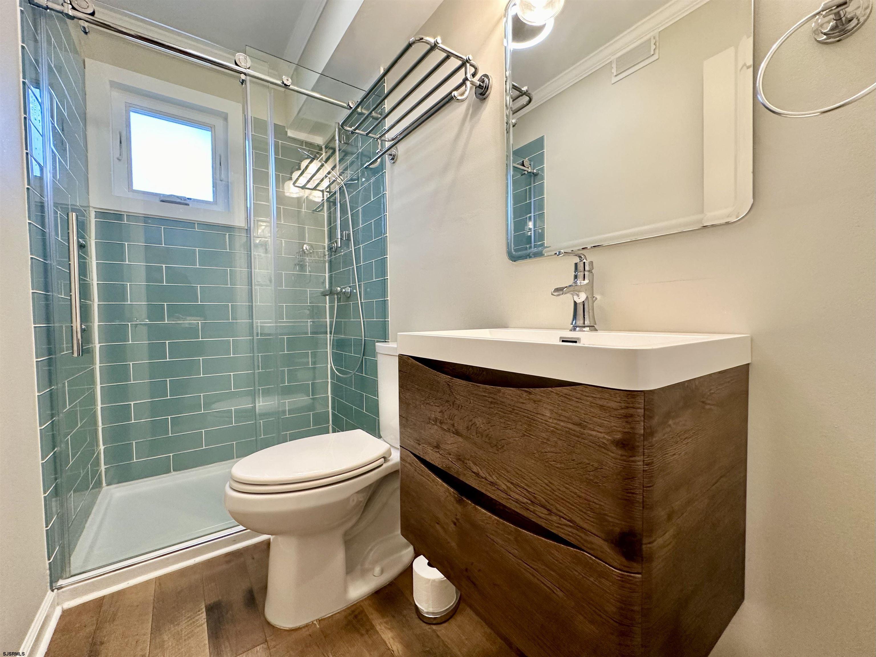 12 Explorer Road Brigantine, NJ 08203 - Photo 15 of 44 a bathroom with a sink toilet and shower