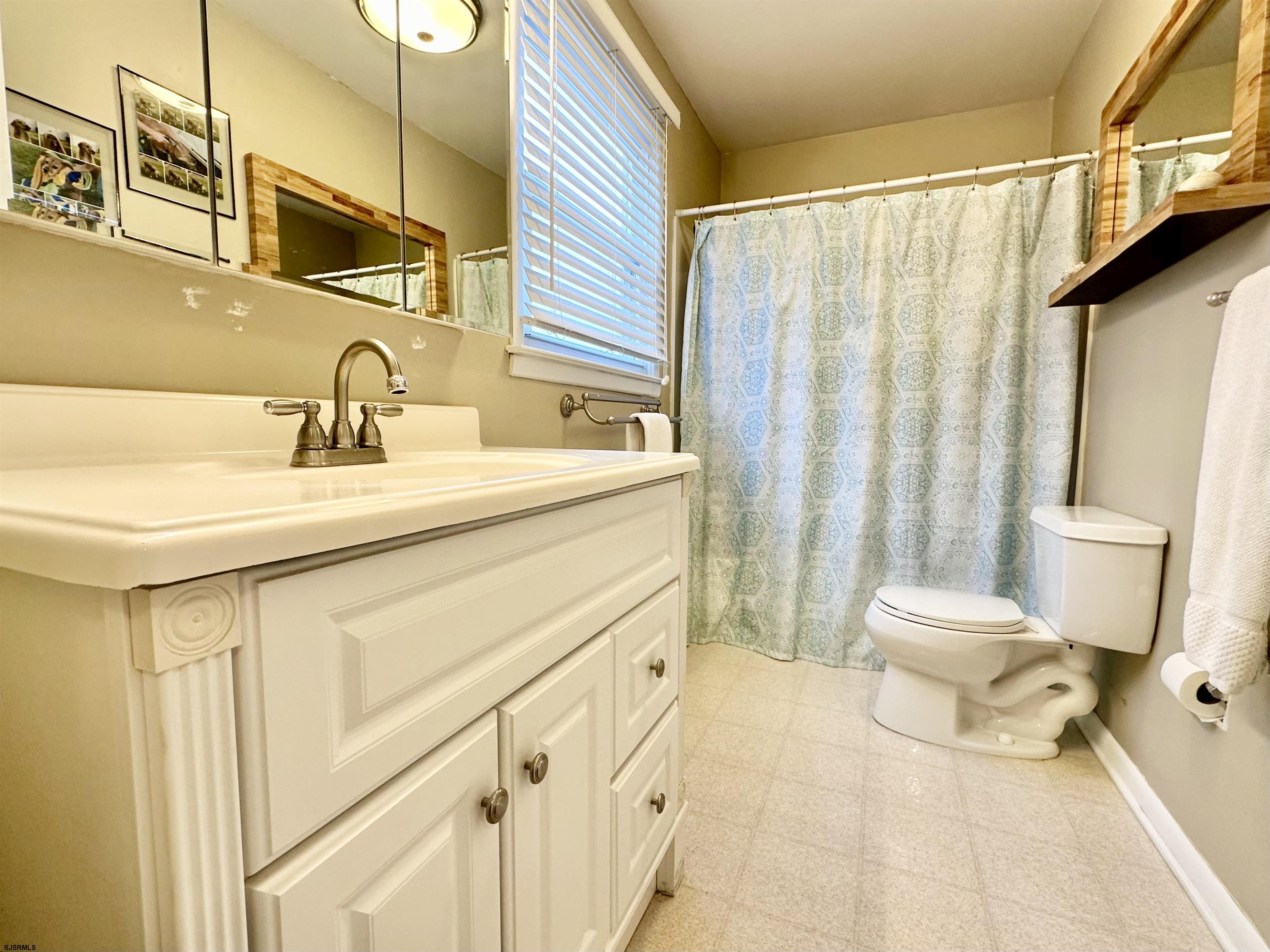 12 Explorer Road Brigantine, NJ 08203 - Photo 22 of 44 a bathroom with a sink toilet and shower