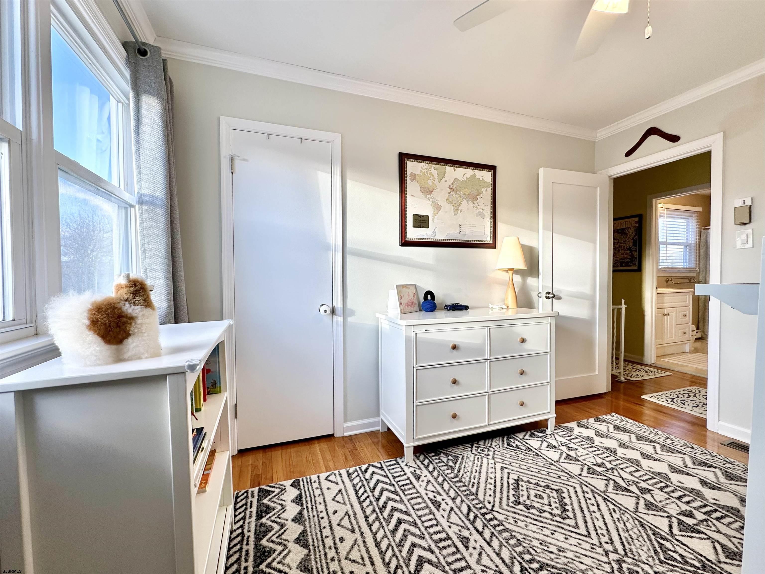 12 Explorer Road Brigantine, NJ 08203 - Photo 26 of 44 a room with a dresser and a window