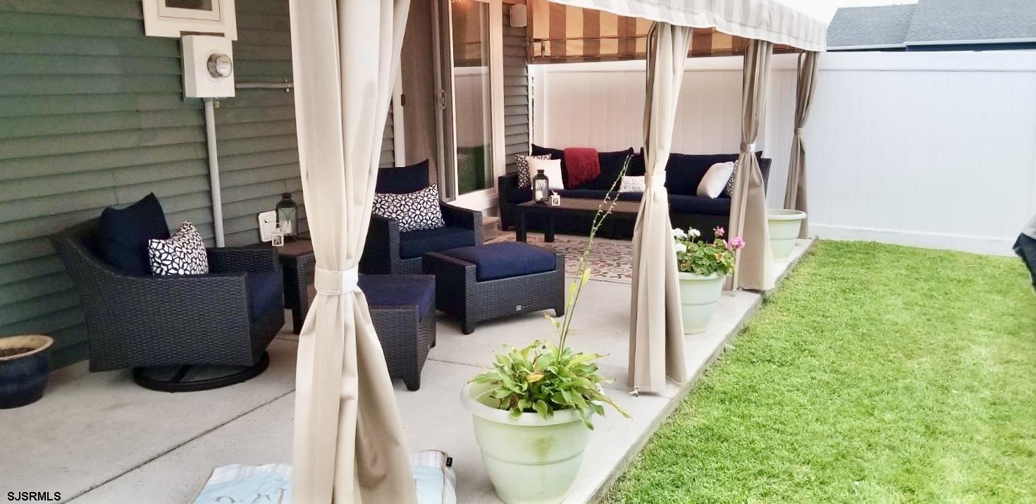 12 Explorer Road Brigantine, NJ 08203 - Photo 28 of 44 a balcony with furniture and a potted plant