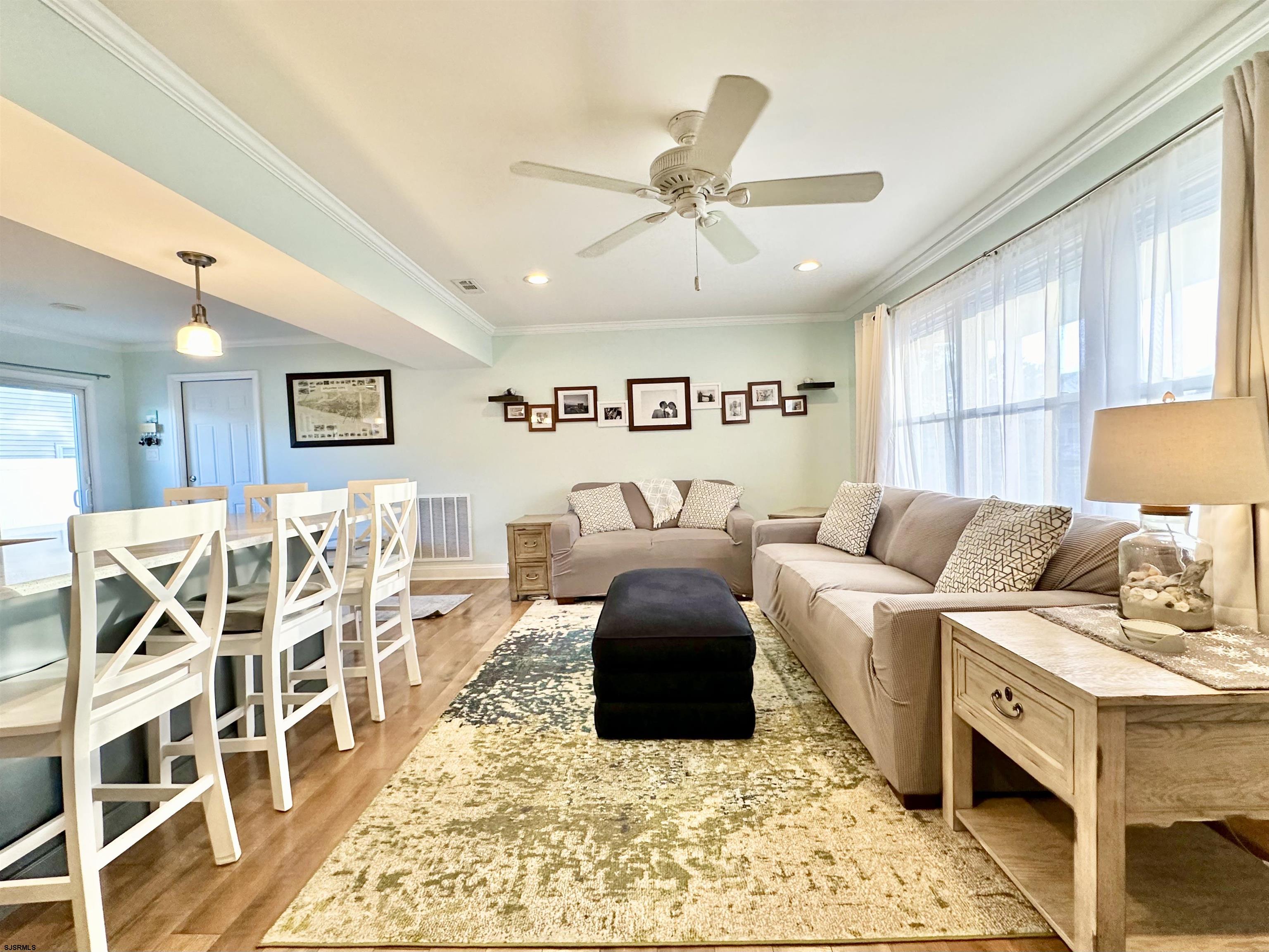 12 Explorer Road Brigantine, NJ 08203 - Photo 5 of 44 a living room with furniture and a view of kitchen