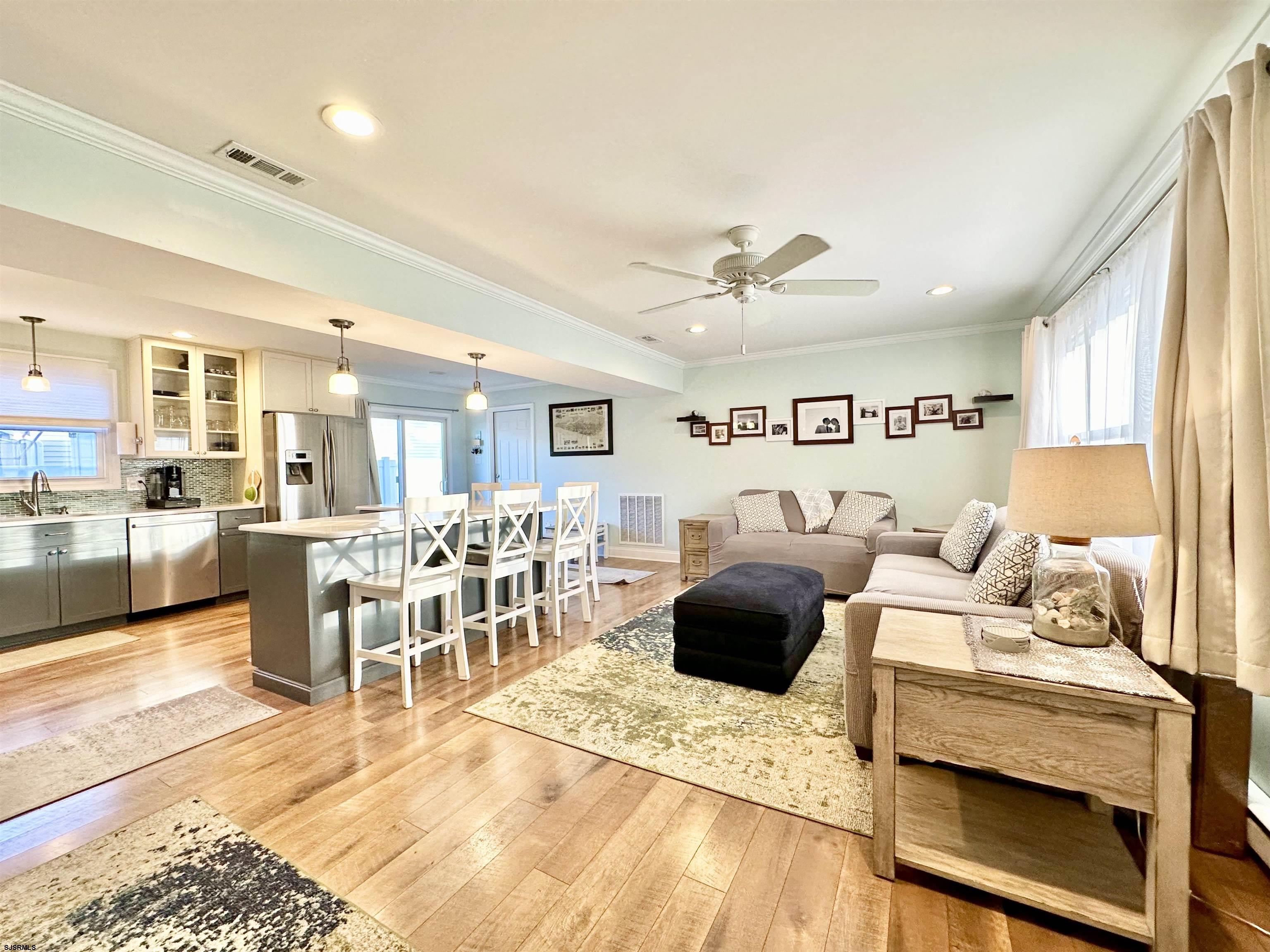 12 Explorer Road Brigantine, NJ 08203 - Photo 6 of 44 a living room with furniture and a large window