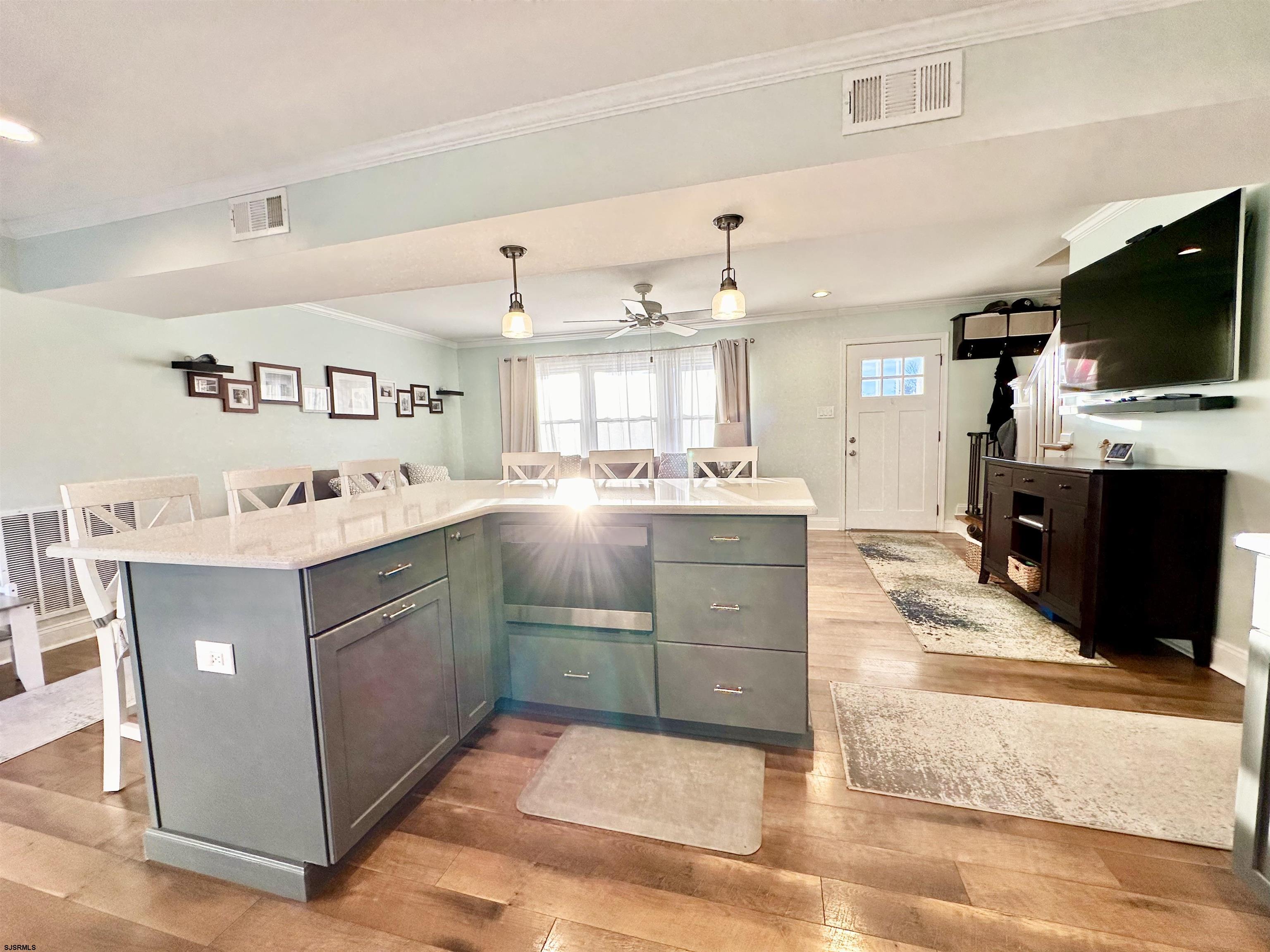 12 Explorer Road Brigantine, NJ 08203 - Photo 10 of 44 a kitchen with kitchen island sink cabinets and stainless steel appliances