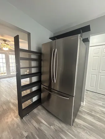 a view of walk in closet with empty racks
