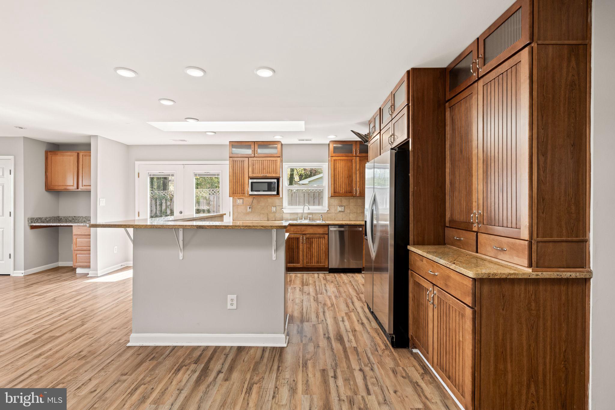 8635 Old Mt Vernon Road Alexandria, VA 22309 - Photo 13 of 47 Modern kitchen with warm wood accents.