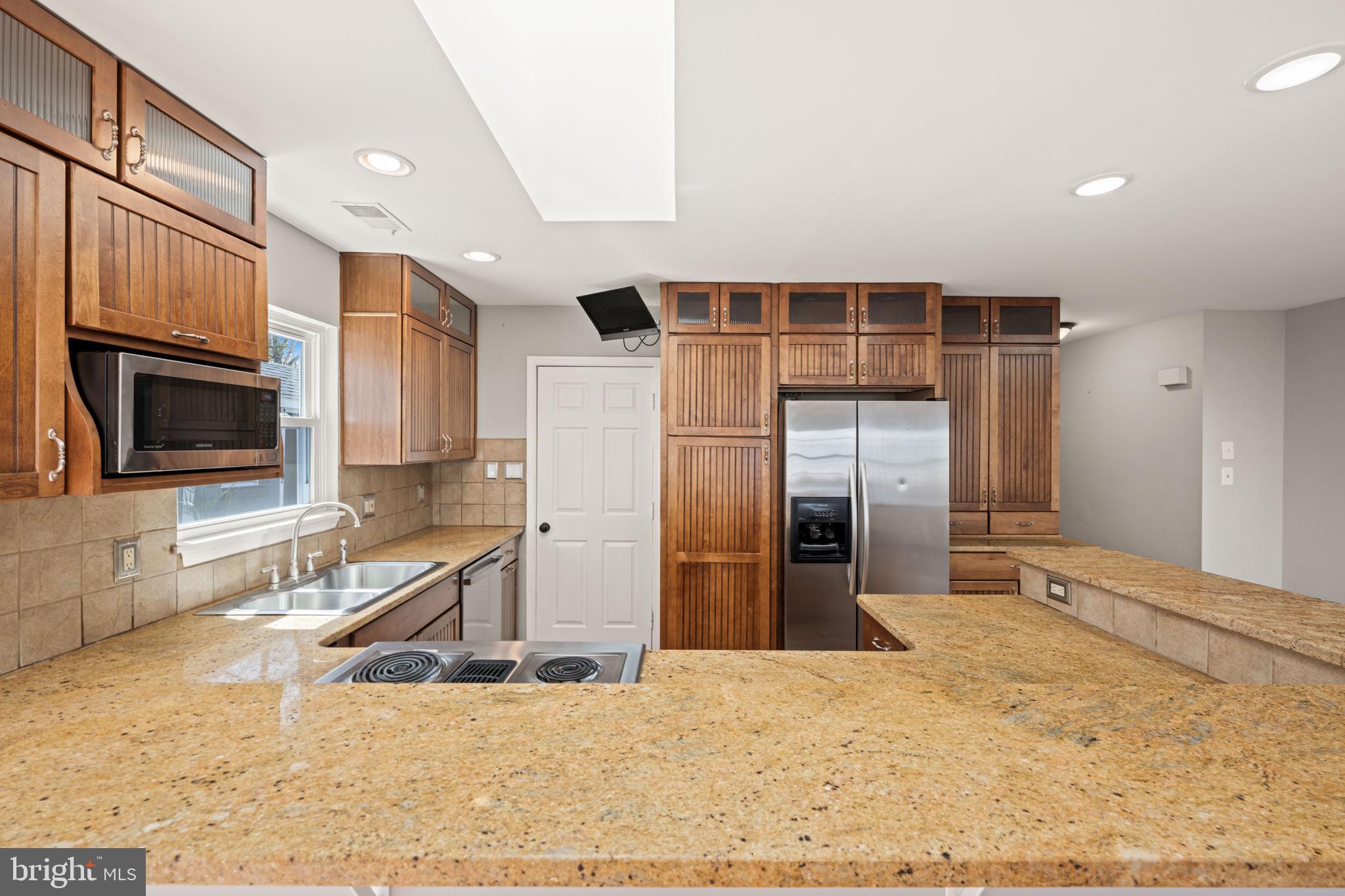 8635 Old Mt Vernon Road Alexandria, VA 22309 - Photo 14 of 47 Warm wood accents in a modern kitchen.