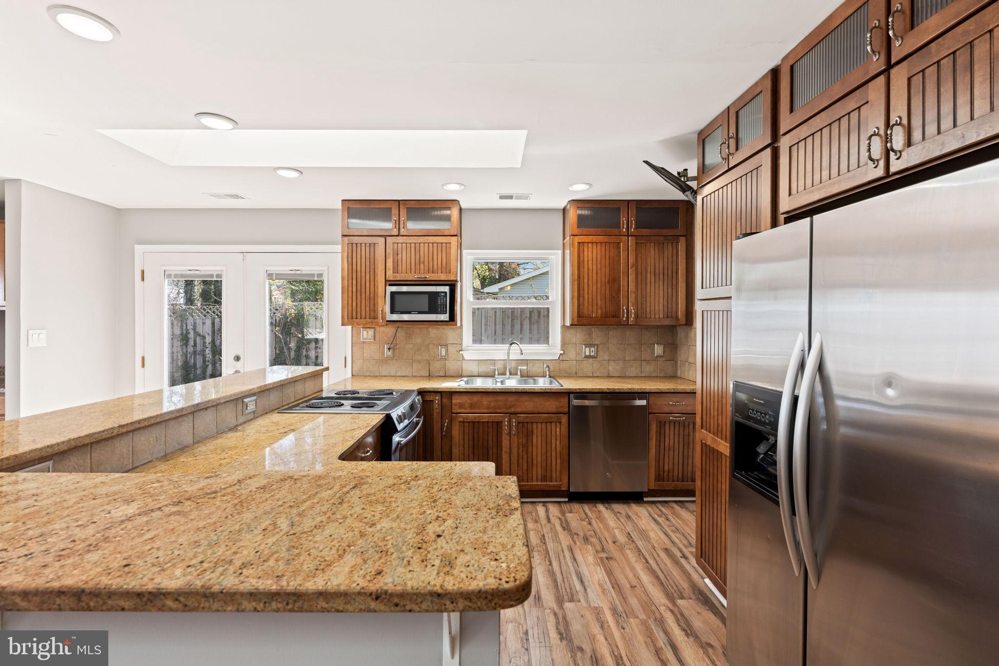 8635 Old Mt Vernon Road Alexandria, VA 22309 - Photo 15 of 47 Modern kitchen with warm wood accents.