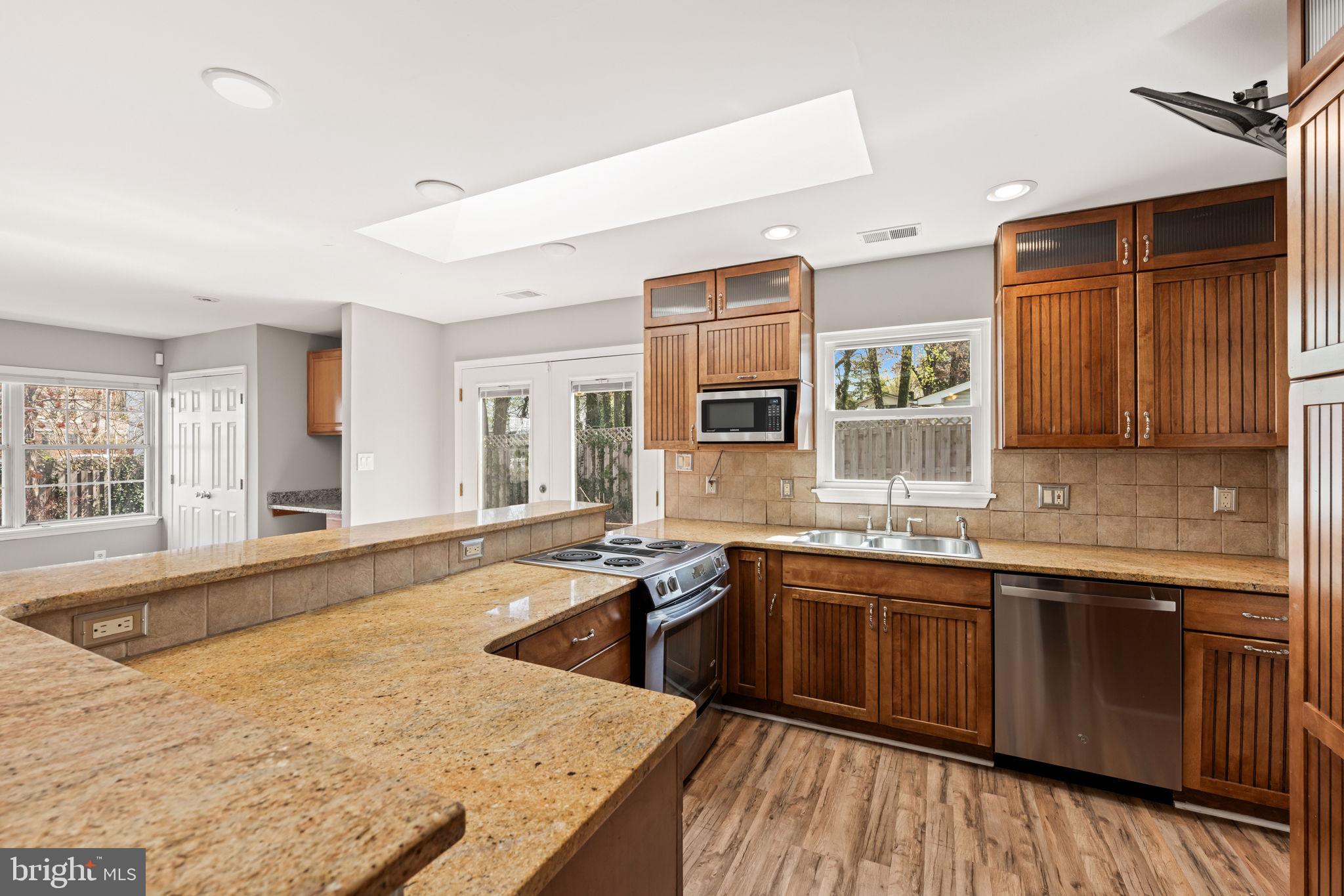8635 Old Mt Vernon Road Alexandria, VA 22309 - Photo 16 of 47 Modern kitchen with warm wood accents.