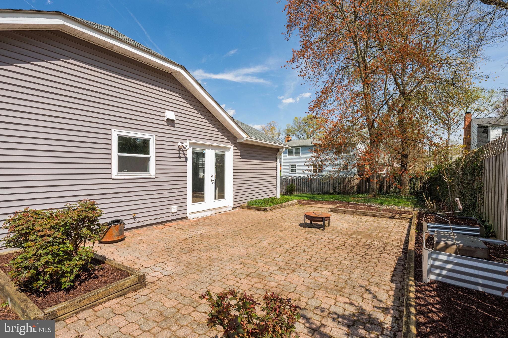 8635 Old Mt Vernon Road Alexandria, VA 22309 - Photo 46 of 47 Sunny patio with lush greenery.