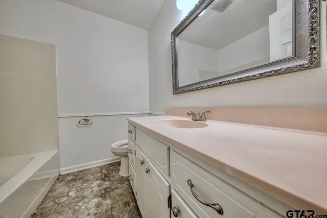 a view of an empty room and wooden floor