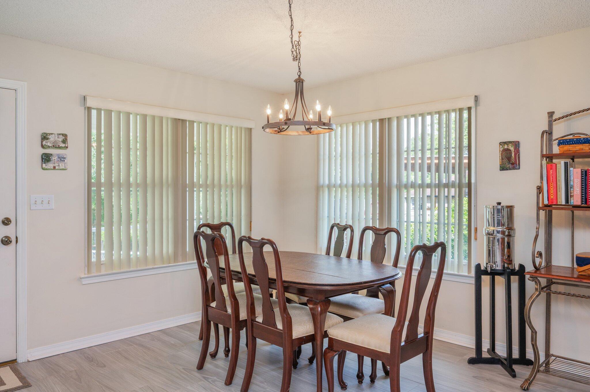 642 Alysheba Drive Crestview, FL 32539 - Photo 11 of 32 a view of a dining room with furniture window and outside view