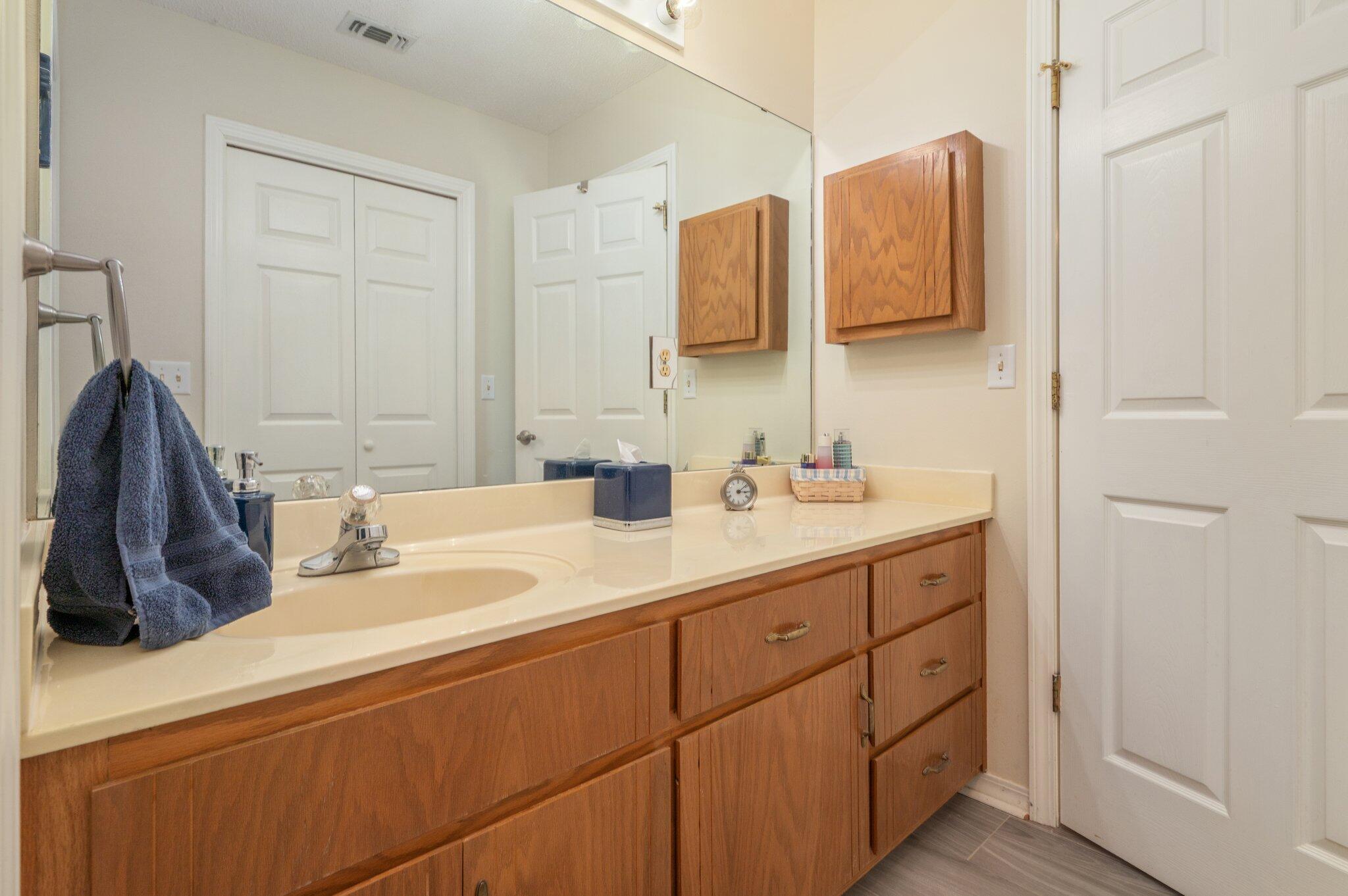 642 Alysheba Drive Crestview, FL 32539 - Photo 16 of 32 a bathroom with a sink and a mirror