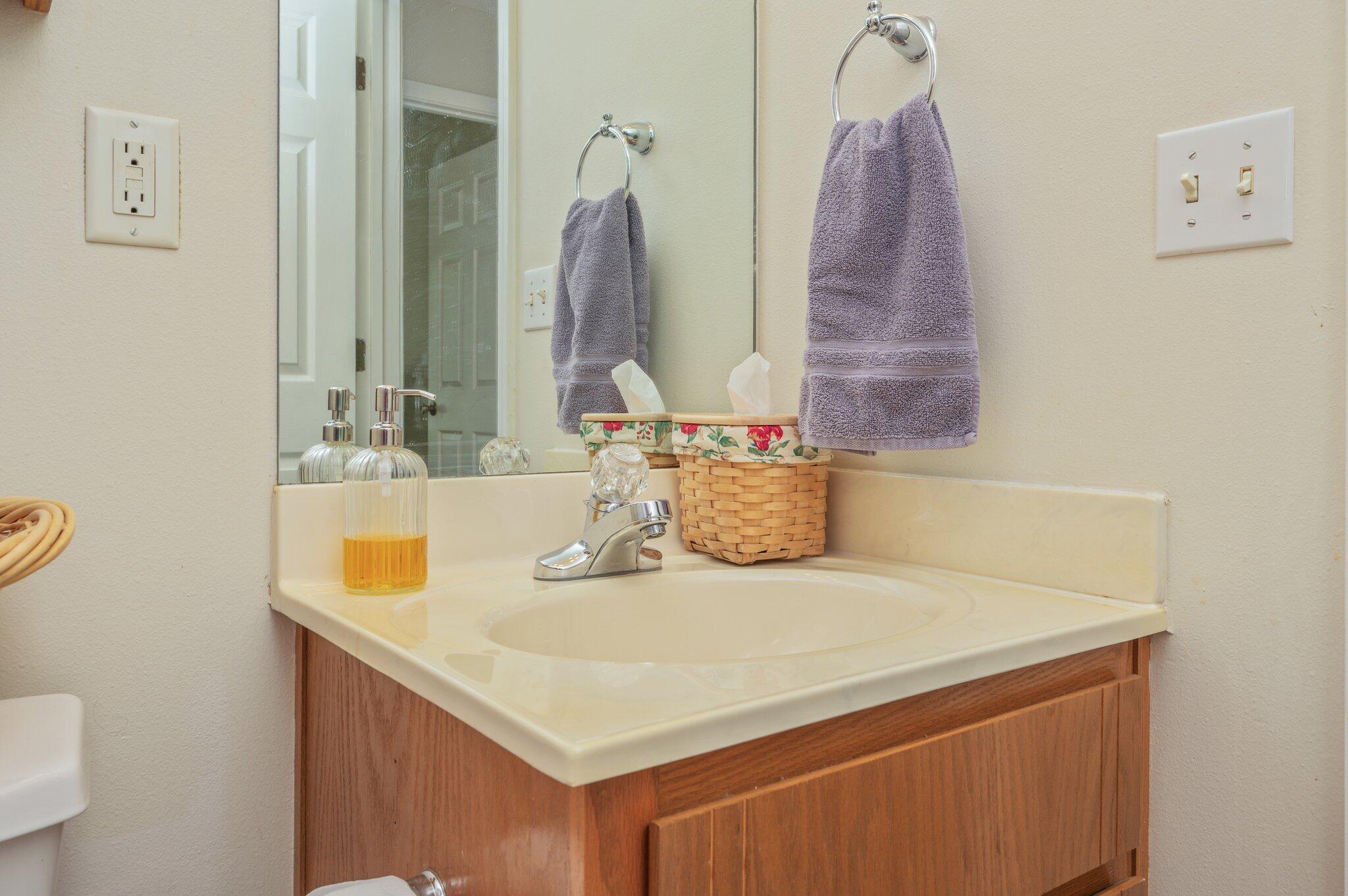 642 Alysheba Drive Crestview, FL 32539 - Photo 19 of 32 a bathroom with a sink vanity and a mirror