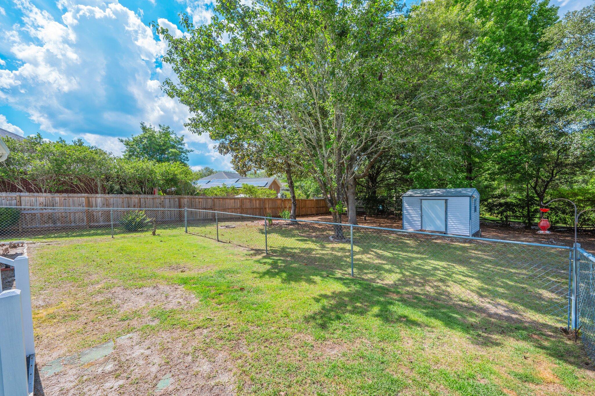 642 Alysheba Drive Crestview, FL 32539 - Photo 24 of 32 a view of a yard with a trampoline